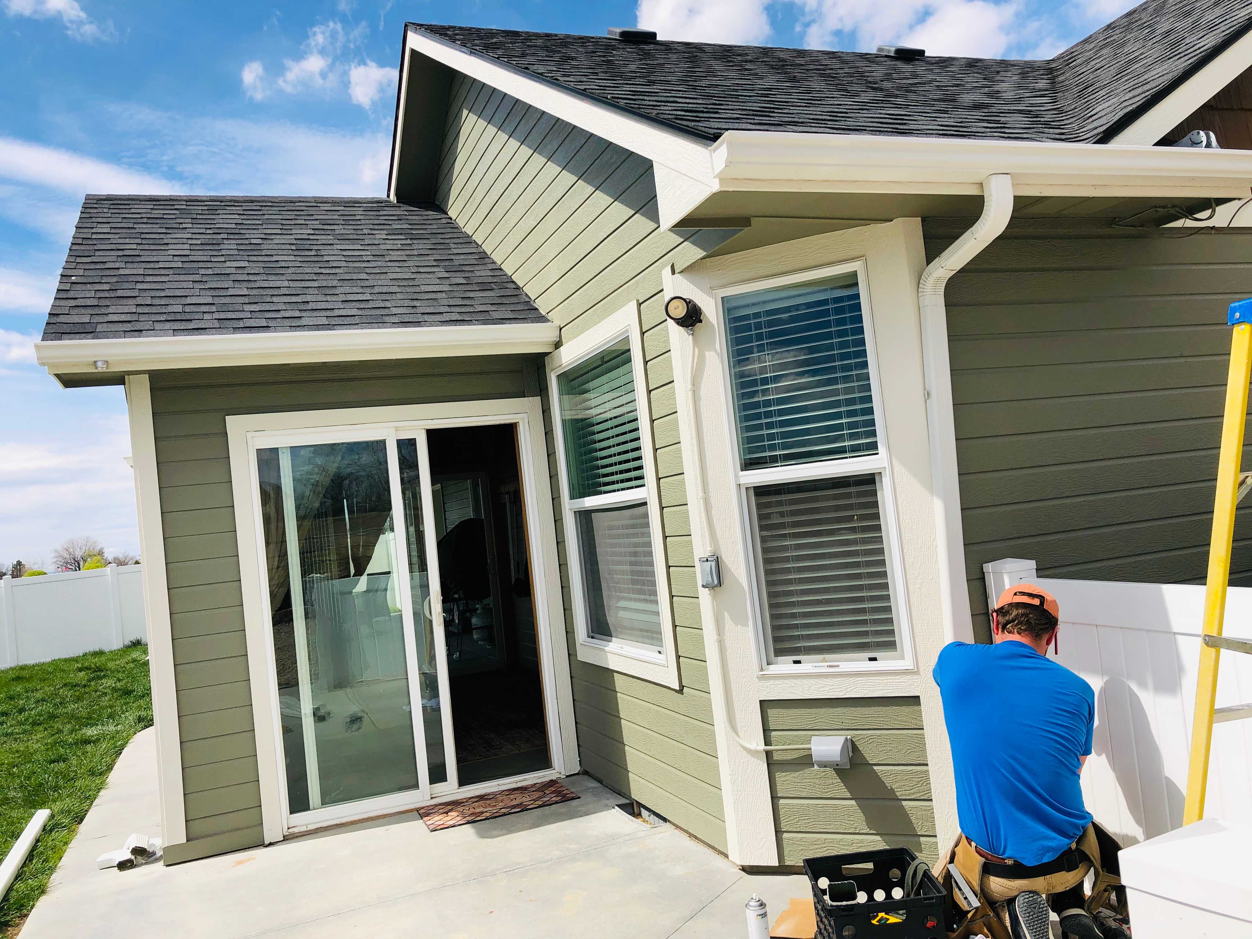 Ben Beers installing a down spout in Nampa, ID.